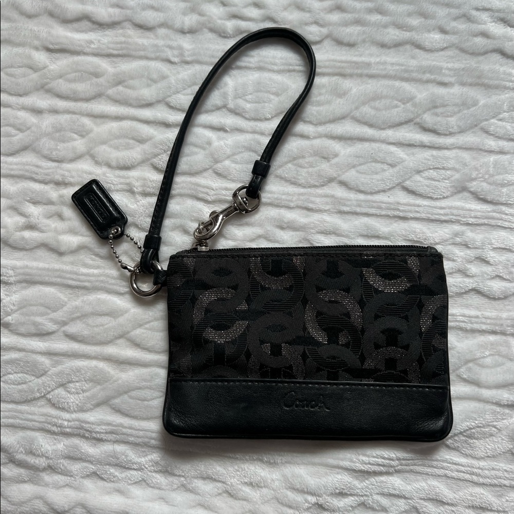 Black and silver Coach wristlet